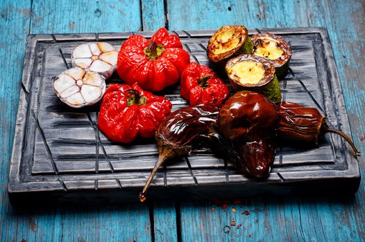 Baked eggplant,peppers and garlic on the kitchen board