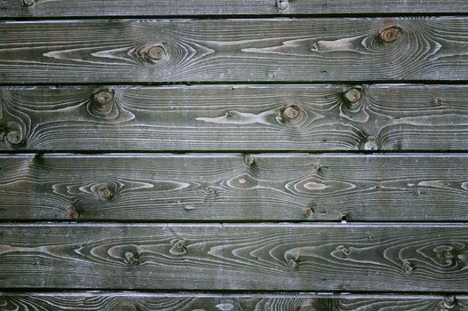 Natural background of wood with annual rings and knots.