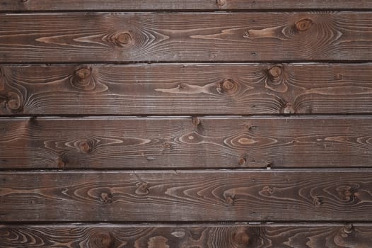 Natural background of wood with annual rings and knots.
