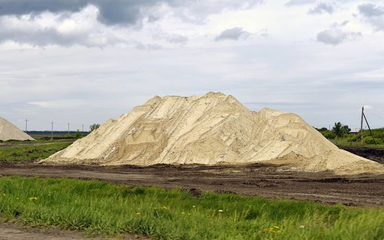  Yellow excavator working digging in sand quarry