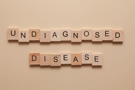 The word Undiagnosed disease formed with wooden letters