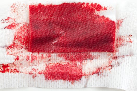 Gauze with blood on white background