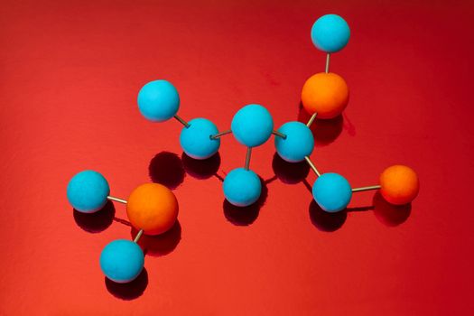 Science Molecule. Chemistry DNA molecule lab test on red background