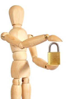 Wooden puppet holds small padlock on white background