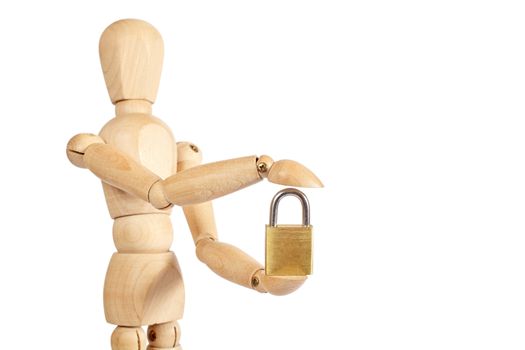 Wooden puppet holds small padlock on white background