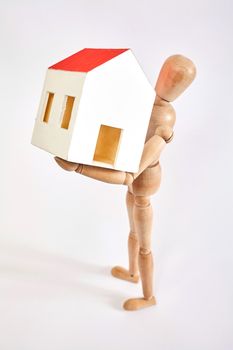 Dummy carrying small house on white background