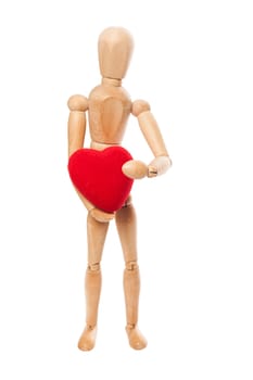 Dummy holding a red heart on white background with clipping path