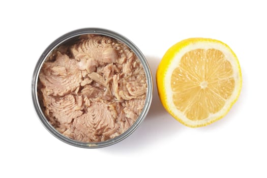 Open tuna tin with half lemon on a white background