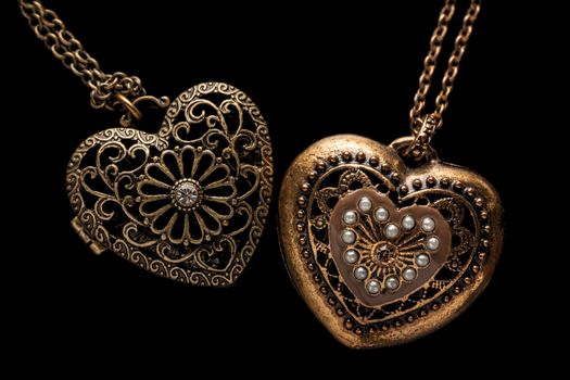 Heart-shaped necklace on black background