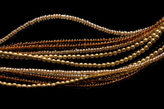 Jewelry of beads on black background