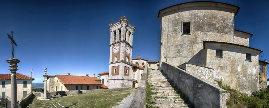 Square of the church, Sacred Mount of Varese in a limpid morning summer with blue sky in background