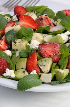 Salad spinach with strawberries, avocado, mint, ricotta and sesame,poppy seeds 