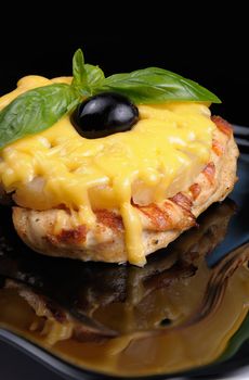 pieces of chicken   brisket a slice of pineapple with cheese  , olives and basil