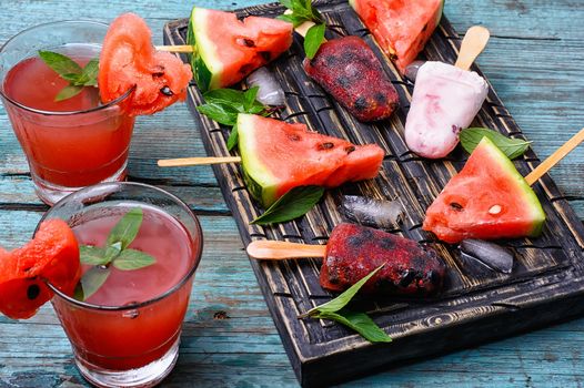 Homemade ice cream with watermelon flavor in stylish wooden tray