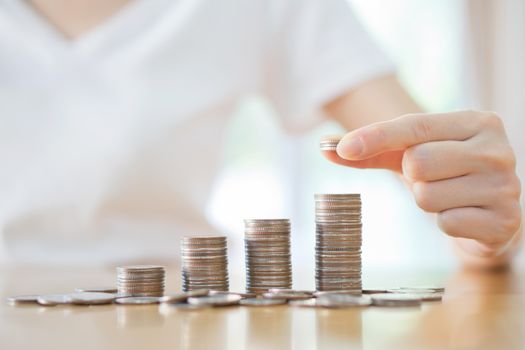 women put coin stack money for money growth concept