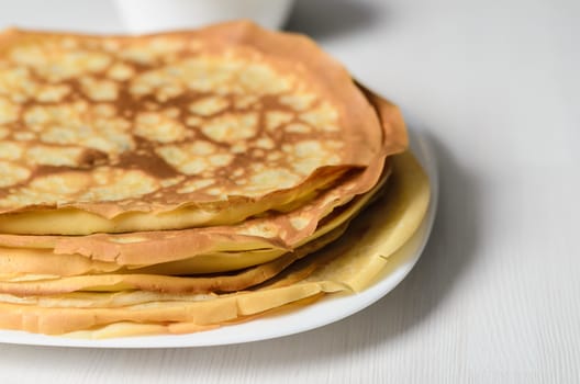 homemade pancakes on a white plate with cottage cheese