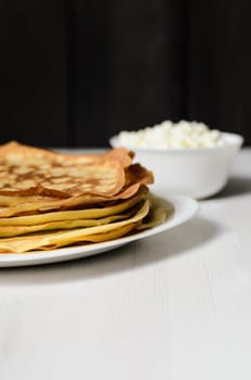 homemade pancakes on a white plate with cottage cheese