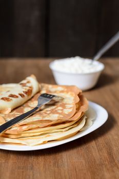 homemade pancakes on a white plate with cottage cheese