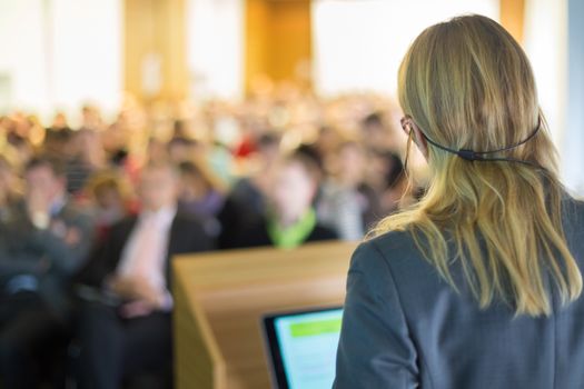 Female speaker at Business Conference and Presentation. Audience at the conference hall. Business and Entrepreneurship. Business woman.