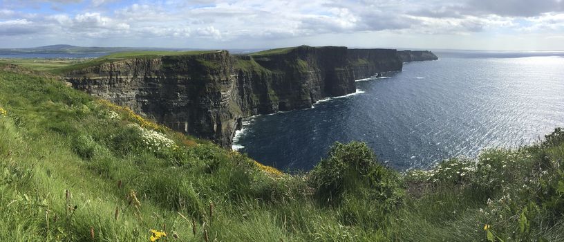 The Cliffs of Moher - located at the southwestern edge of the Burren region in County Clare, Ireland. They rise 120 metres (390 ft) above the Atlantic Ocean at Hag's Head and reach their maximum height of 214 metres (702 ft) here just north of O'Brien's Tower.