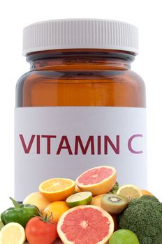 Vitamin c rich foods with a medicine pill jar in the background 