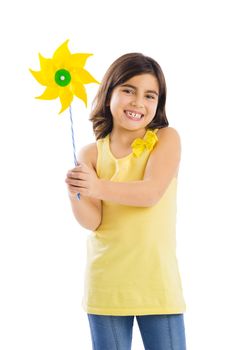 Little girl playing with a toy windmill