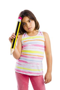 Beautiful young girl with a thinking expression while holding a big pencil