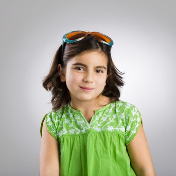 Portrait of a happy young girl wearing funny sunglasses