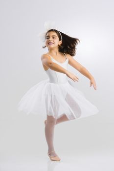 Beautiful little girl practicing ballet