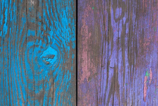 texture of wooden surface with remnants of old paint that has dried and cracked under the influence of weather