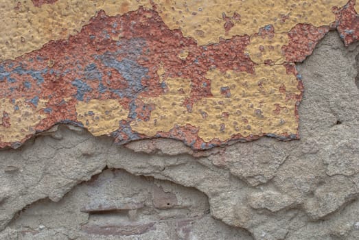 fragment of a concrete wall, which has undergone deformation due to prolonged exposure to various climatic conditions