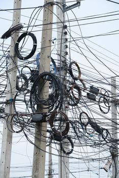 messy electrical cables on pole