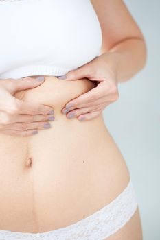 Localized fat in woman abdomen