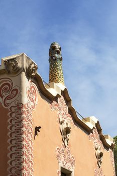 BARCELONA , SPAIN - MAY 13, 2016 : Decorative facade  on Gaudi House Museum with mosaic chimney . Building  located near the Park Guell  in Barcelona was the residence of Antoni Gaudi for almost 20 years, from 1906 to 1925.
