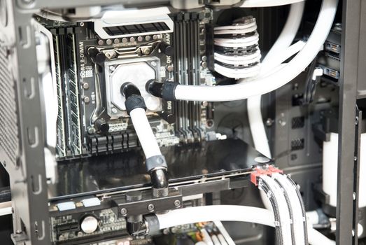 Inside computer water cooling  system in white closeup background
