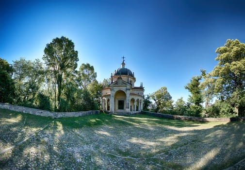 fifth Chapel on the sacred way of the Sacred Mount of Varese in a limpid summer morning, Lombardy - Italy