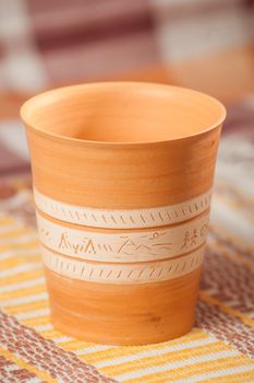 Traditional handcrafted mug on multycolor background. High resolution