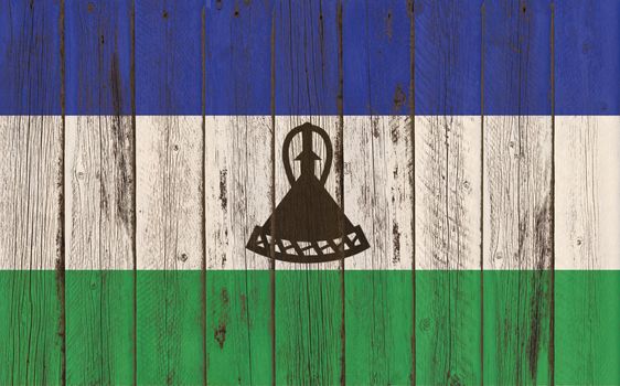 Flag of Lesotho painted on wooden frame