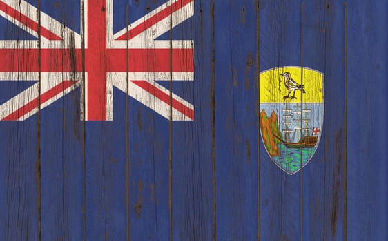 
Flag of Saint Helena painted on grungy wood plank background