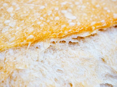 Macro of sourdough bread crust texture. Tasty fresh sourdough bread, close up for background