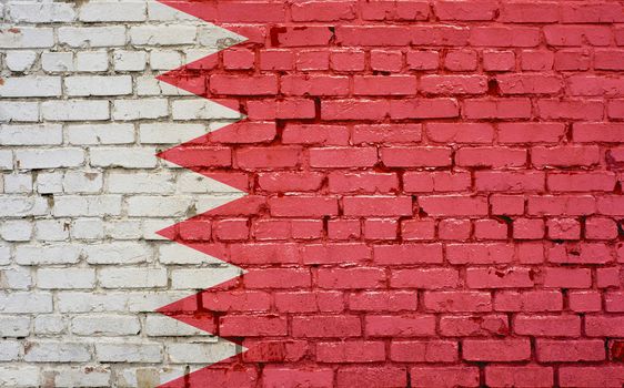 Flag of Bahrain painted on brick wall, background texture