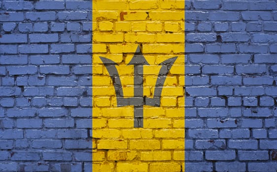 Flag of Barbados painted on brick wall, background texture