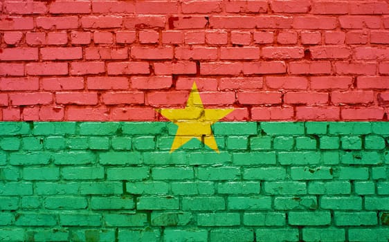 Flag of Burkina Faso painted on brick wall, background texture