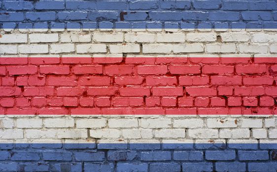 Flag of Costa Rica painted on brick wall, background texture