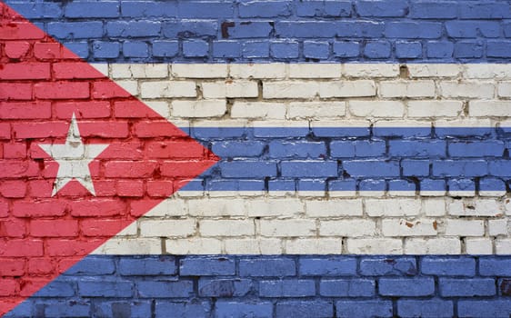 Flag of Cuba painted on brick wall, background texture