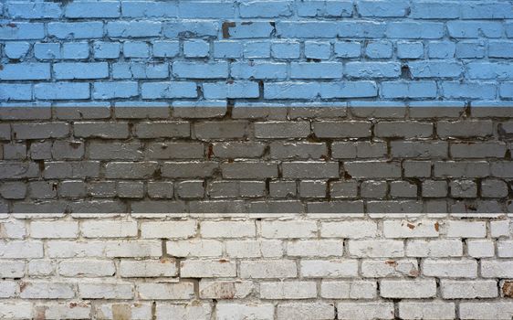 Flag of Estonia painted on brick wall, background texture