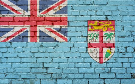 Flag of Fiji painted on brick wall, background texture