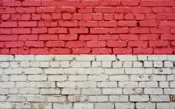 Flag of Monaco painted on brick wall, background texture