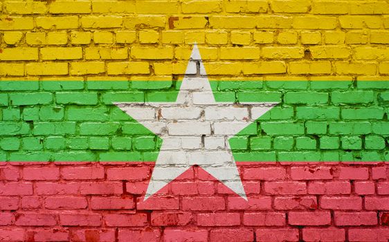flag of Myanmar painted on brick wall