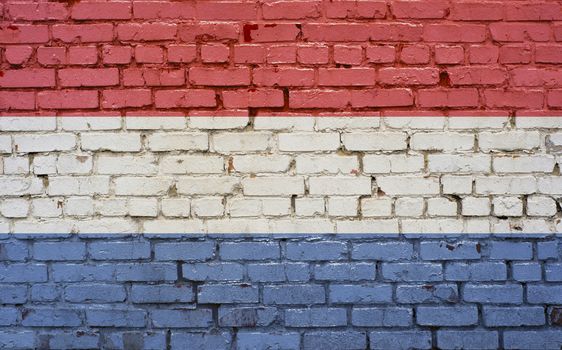 Flag of Netherlands painted on brick wall, background texture
